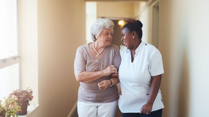 A carer taking care of an elderly client